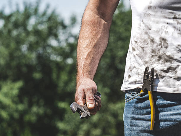 istock Attractive worker, spanner, pliers and dirty t-shirt 2226299756