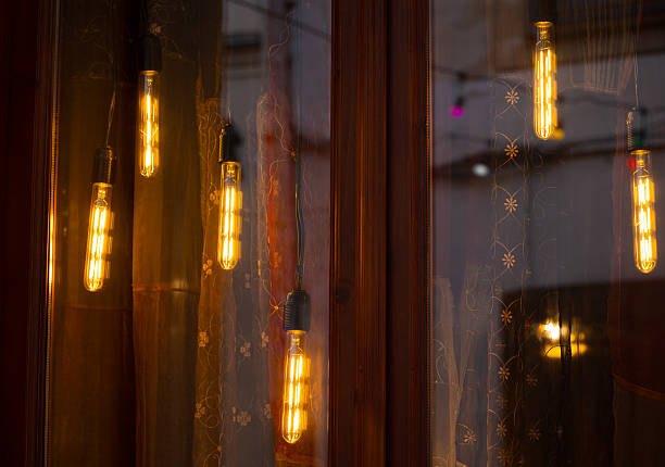 istock warm light hanging lamps decorative illumination garland windows fuzzy reflection dusk background space 2226300253