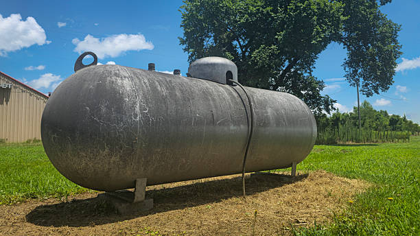istock Large industrial propane tank installed outdoors on grass, designed for fuel storage and efficiency. The tank showcases durability and purpose for various industries and homes 2226305441