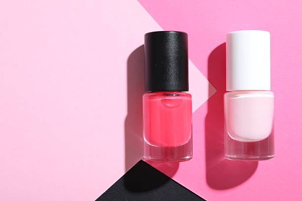 istock Nail polishes in bottles on color background, flat lay. Space for text 2226305509