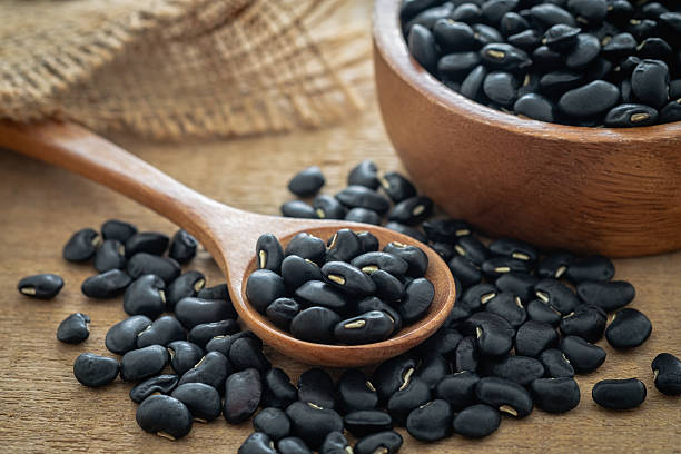 istock Black bean on wooden spoon 2226305766