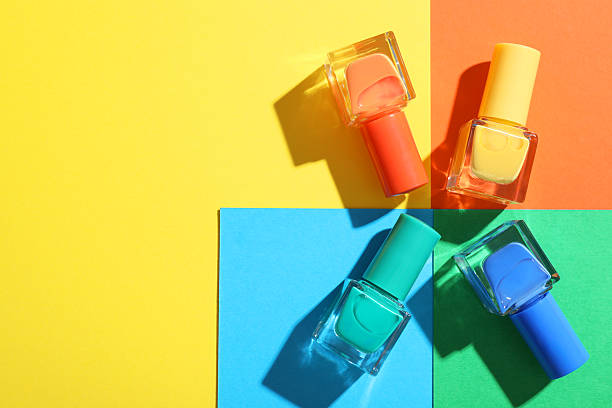 istock Nail polishes in bottles on color background, flat lay. Space for text 2226306383