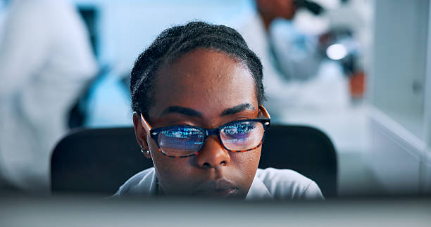 istock Glasses, science and computer with woman in laboratory for biomedical research, gene editing and healthcare innovation. Medical breakthrough, dna code and genome project with person for biotech data 2226308251