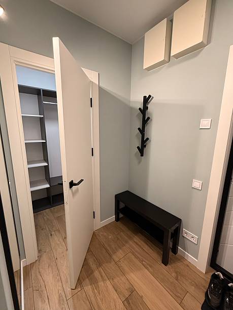 istock Minimalist Entryway with Bench and Open Closet 2226310759