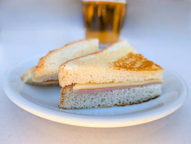 istock Delicious ham sandwich served with crispy bread and a refreshing beverage in a cozy dining setting 2226310892