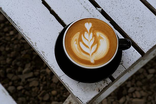 : Latte Art Captured Top View on Wooden Table