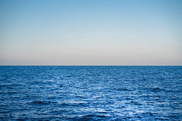 istock Relaxing summer by the serene blue sea under a clear sky at sunset. Background. 2226315267