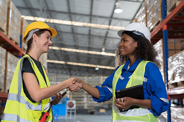 istock Group of warehouse worker join hands together, meeting, Work completed successfully. Collaboration colleagues, teamwork and unity in warehouse 2226324184