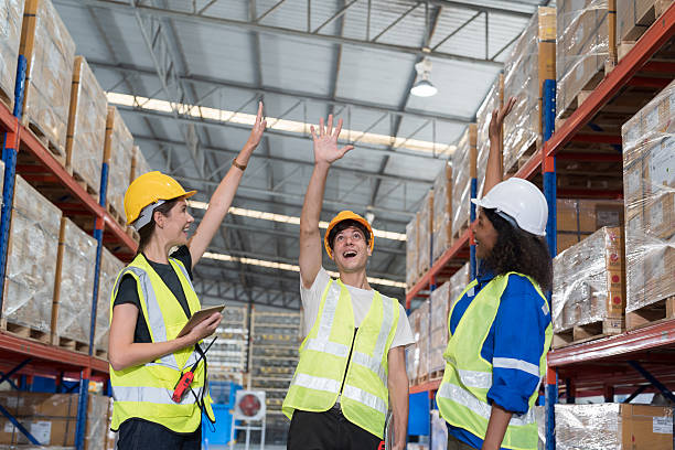 istock Group of warehouse worker join hands together, meeting, Work completed successfully. Collaboration colleagues, teamwork and unity in warehouse 2226324303