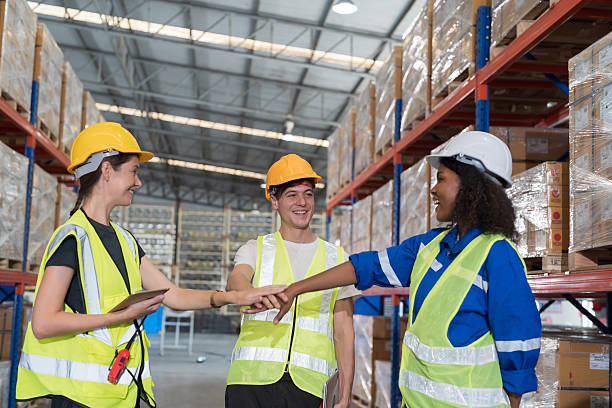 istock Group of warehouse worker join hands together, meeting, Work completed successfully. Collaboration colleagues, teamwork and unity in warehouse 2226324306