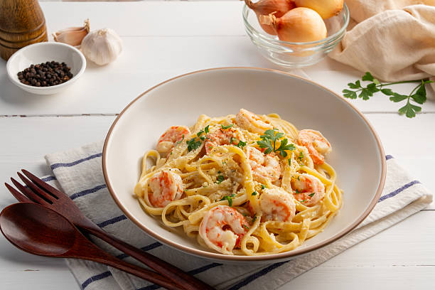 istock Pasta carbonara with shrimp in white plate. 2226327058