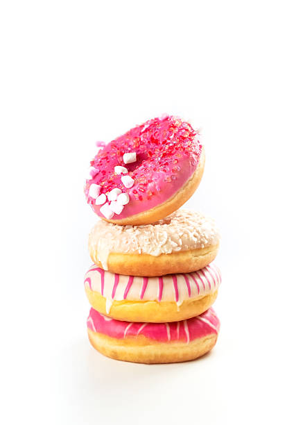 istock Colorful stack of delicious donuts with frosting and sprinkles on a white background 2226329806