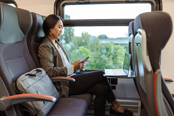 istock Businesswoman working on a train and using a smartphone 2226331564