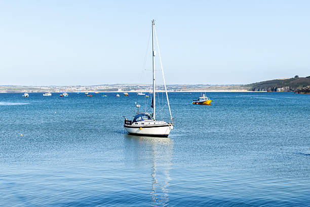 St Ives UK 9th July 2025 St Ives looking beautiful in the sunshine, blue sky, turquoise sea,  boats moored in the harbour, houses on a hill.