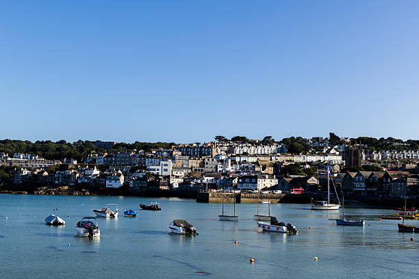 St Ives UK 9th July 2025 \nSt Ives looking beautiful in the sunshine, blue sky, turquoise sea,  boats moored in the harbour, houses on a hill.