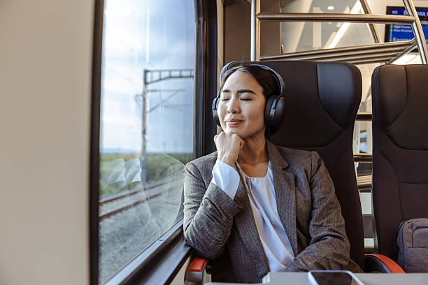 istock Woman relaxing while traveling on a train during a peaceful afternoon 2226333360
