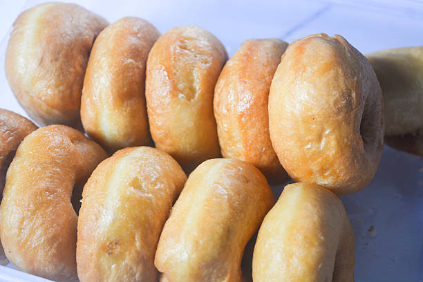 Close up of original donuts without toppings on a white background. Isolated objects