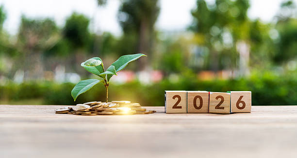 istock Coin jar and number 2026 on the table 2226337199