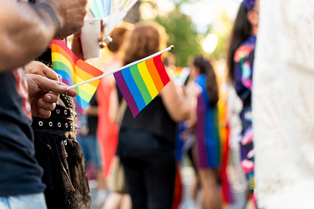 istock People holding rainbow flags celebrating gay pride 2226338586