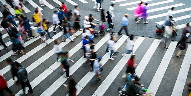 istock Motion blurred crowd of people walking on crosswalk 2226338677
