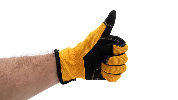 istock Gloved hand giving thumbs up gesture in daylight 2226338795