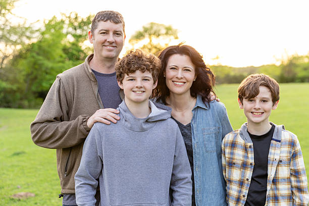 istock Happy Family Portrait Outdoors at Sunset 2226340870