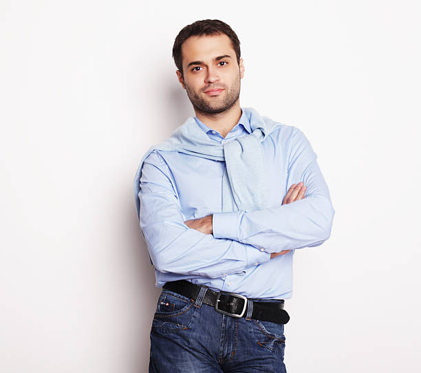 istock happy young man in blue shirt. 2226342270