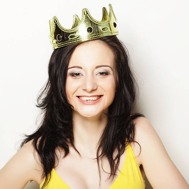 istock pretty brunette woman wearing crown 2226342317