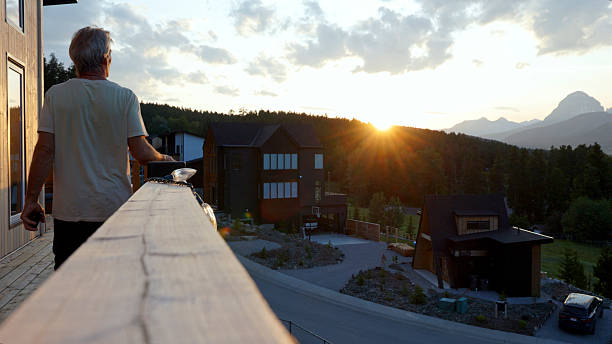 istock Mature man with mobile phone on cabin deck at sunset 2226347486