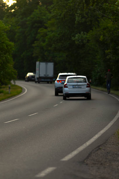 istock A blurred image depicting cars driving swiftly down a roadway 2226349211