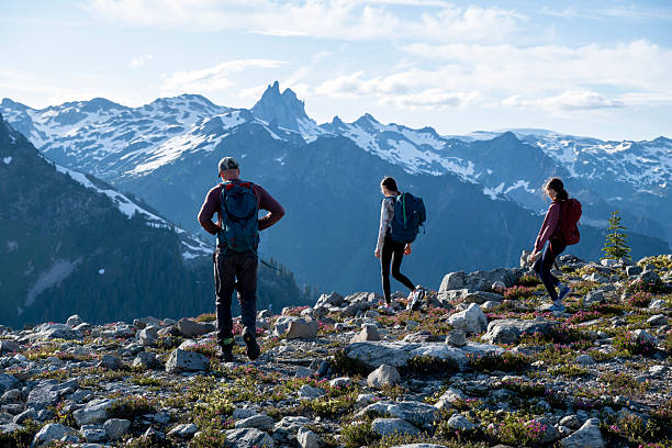 istock Father and teen daughters backpack in mountains 2226350275
