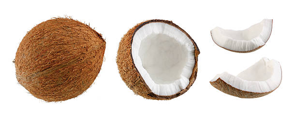 istock Excellently retouched whole coconut, half and two pieces isolated on white. Symbolizes the process of cutting and cleaning the coconut to the state of consumption 2226350996