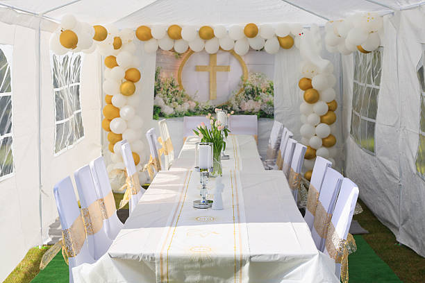 istock Garden tent for a communion party with a table and white decorations. 2226351332