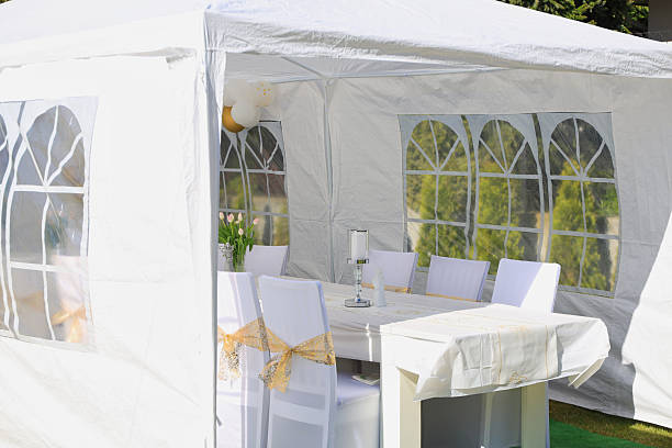 istock Garden tent for a communion party with a table and white decorations. 2226351438