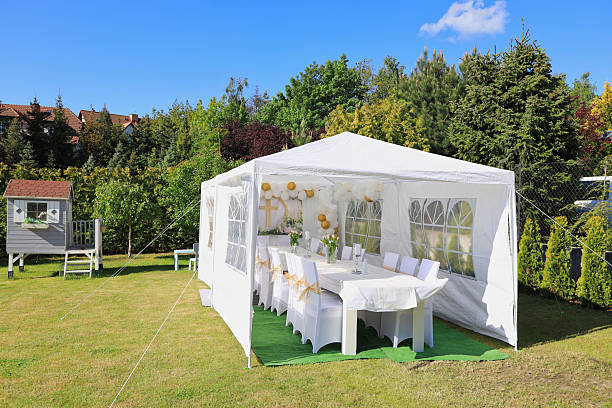 istock Garden tent for a communion party with a table and white decorations. 2226351439