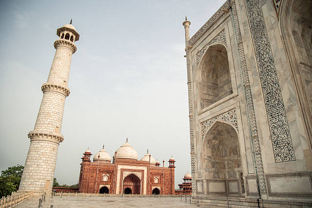 June 11, 2025. Taj Mahal complex in Agra, India, features stunning Mughal architecture with the iconic Taj Mahal, a mosque, and a minaret under a clear sky