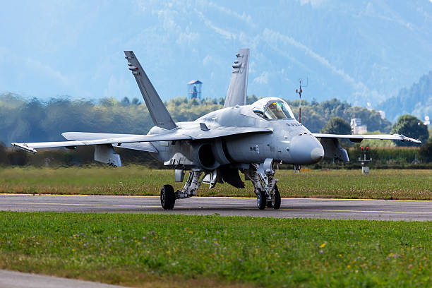 Miramar, California, USA - September 25, 2022: Two US Marine Corps FA-18 Hornets sit on the tarmac at sunrise for the 2022 Miramar Airshow.