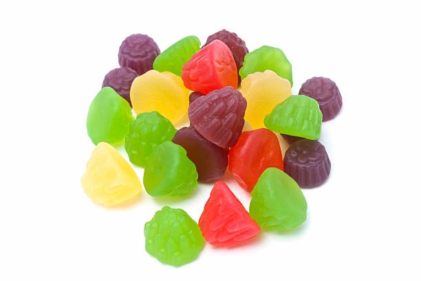 istock Gummy candies in various fruit shapes, on white. 2226356133