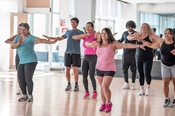 istock Group Fitness Class With Diverse Participants Performing Aerobic Dance Activities 2226356200