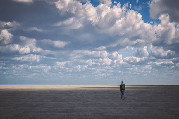 Surreal image of man walking in giant concrete platform