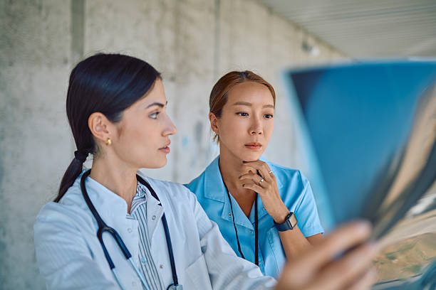 istock Doctors examining radiography in hospital corridor 2226361581