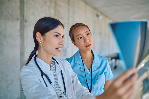 istock Doctors examining radiography in hospital corridor 2226361583