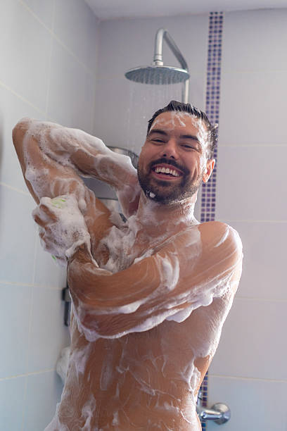 istock Young happy man taking a shower in the morning 2226363285