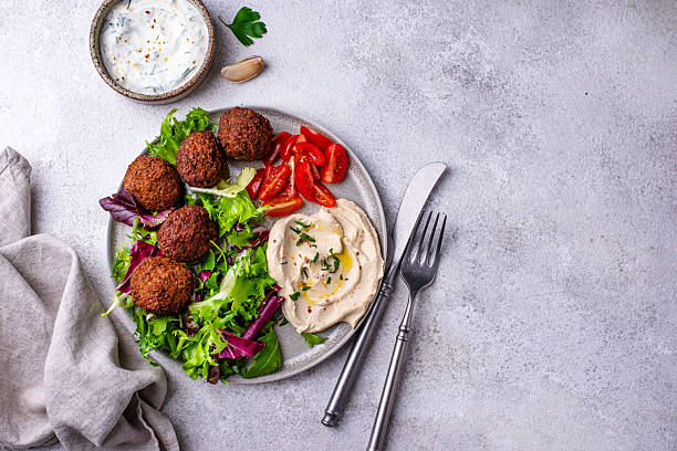 istock Salad with hummus, falafel and vegetables 2226364261