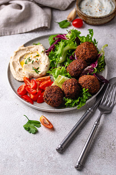 istock Salad with hummus, falafel and vegetables 2226364812