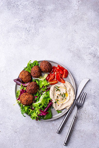 istock Salad with hummus, falafel and vegetables 2226366012