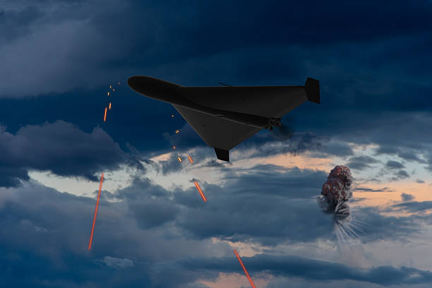 A missile is launched in pursuit of a drone, leaving a fiery trail as it heads towards its target against a sunset sky. The image captures a tense moment in aerial combat, highlighting modern warfare technology and defense tactics.