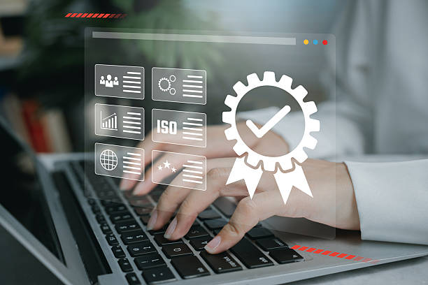 istock Quality assurance concept. Businesswoman using laptop with virtual certification, compliance and standard management interface. 2226369535