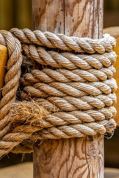 istock Thick Coiled Rope Wrapped Around a Wooden Post 2226369778