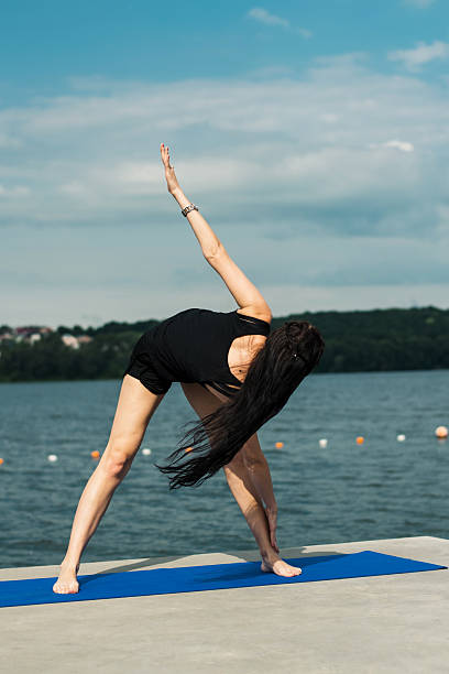 istock A young girl enjoys a Pilates class. 2226370598